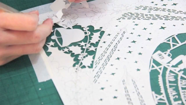 Rob Ryan - paper cutting the Heathrow Christmas card Rob Ryan - paper cutting the Heathrow Christmas card
