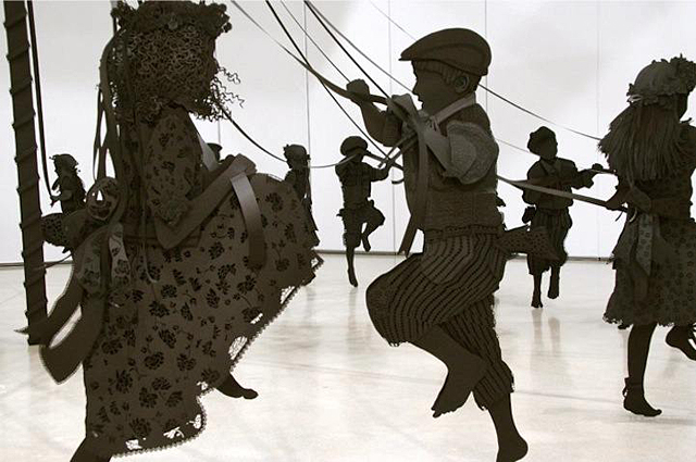 Paper Sculpture of Children Happily Dancing