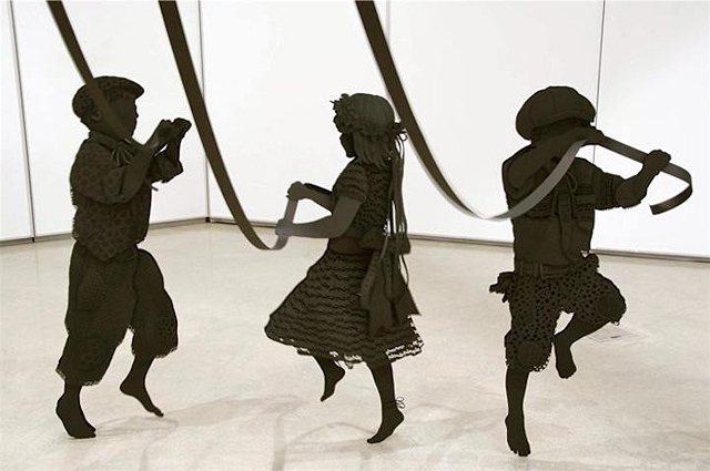 Paper Sculpture of Children Happily Dancing