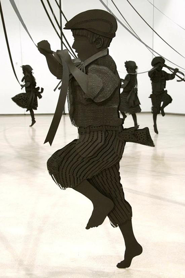 Paper Sculpture of Children Happily Dancing